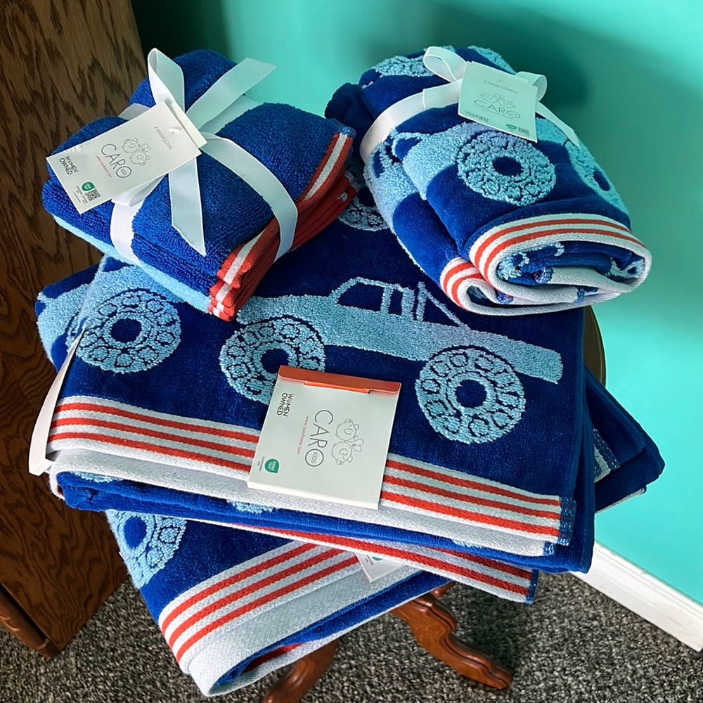 Set of brand new with tags Caro Kids bath towels in a monster truck pattern